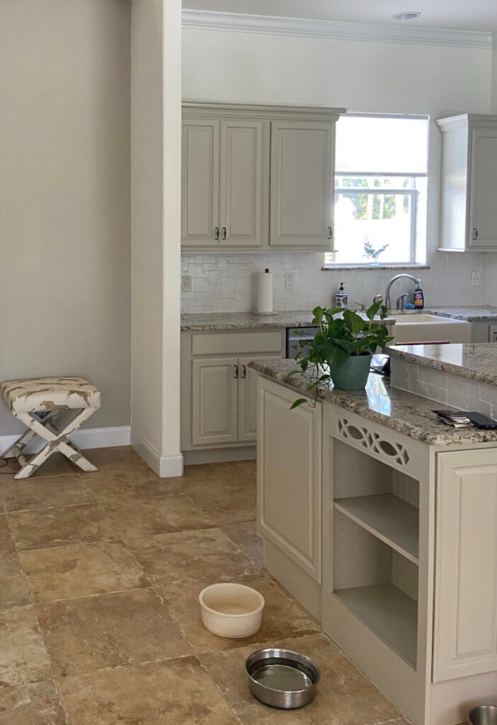 A kitchen features BM White Dove kitchen walls with Revere Pewter cabinets.