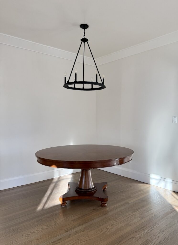 A dining room painted with Benjamin Moore Dove Wing paint.