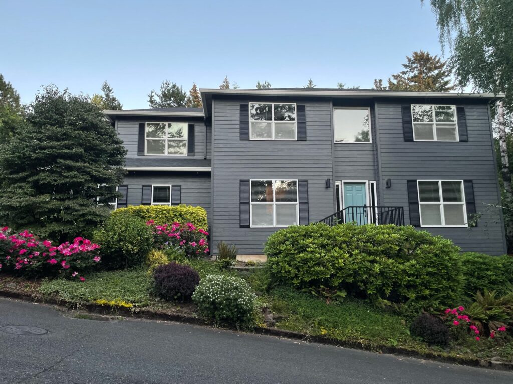 A home features a Sherwin-Williams Peppercorn exterior paint color palette.
