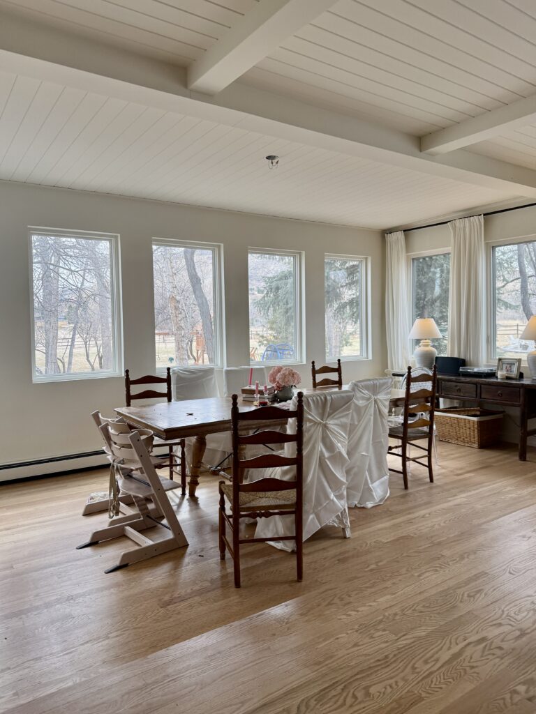 A dining room painted with Sherwin-Williams Creamy off-white paint.