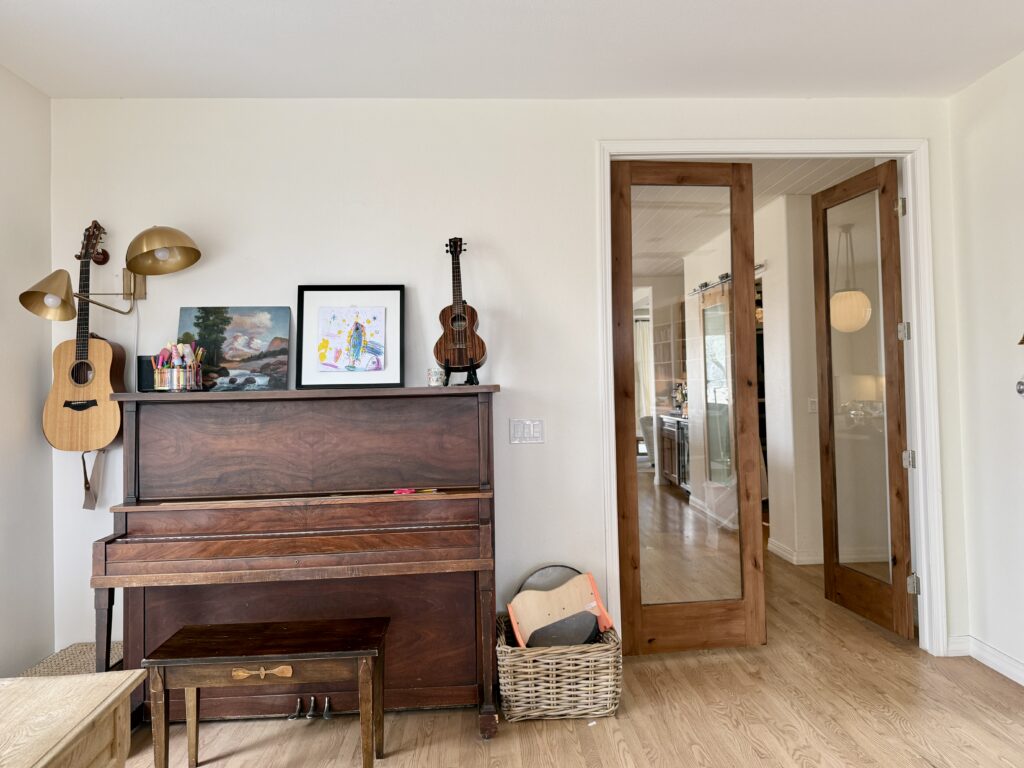 A bright room painted with SW Creamy walls and lots of natural sunlight.