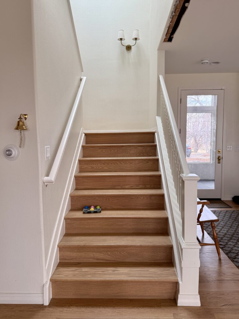 A stairwell painted with SW Creamy walls.