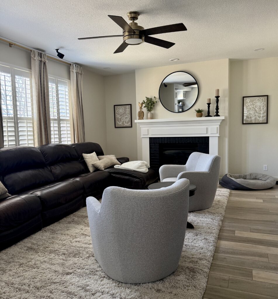A living room is painted with Benjamin Moore Ballet White paint, a very light beige paint color with green undertones.