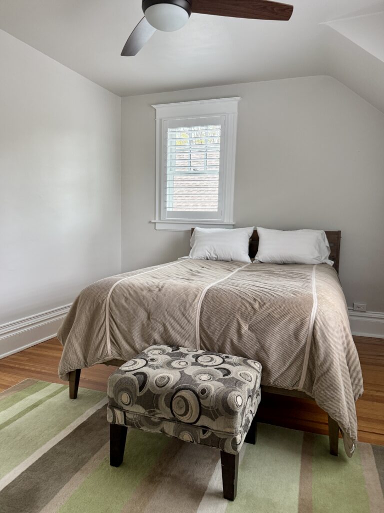 A bedroom painted with BM Pale Oak