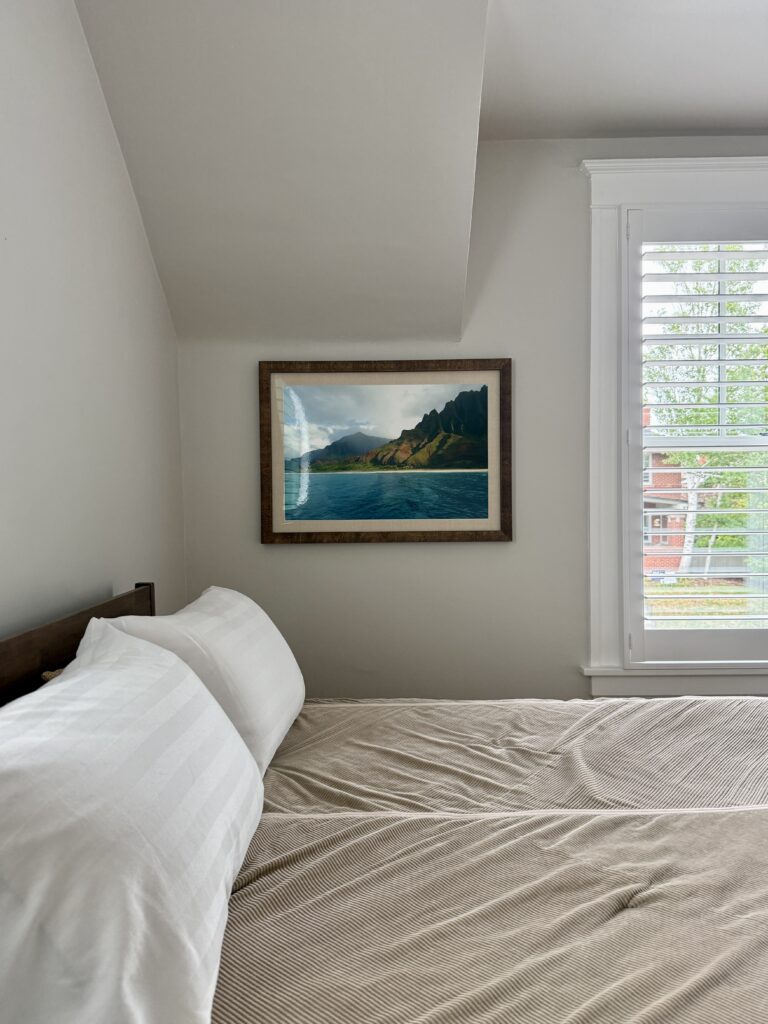 A bedroom painted with BM Pale Oak paint.