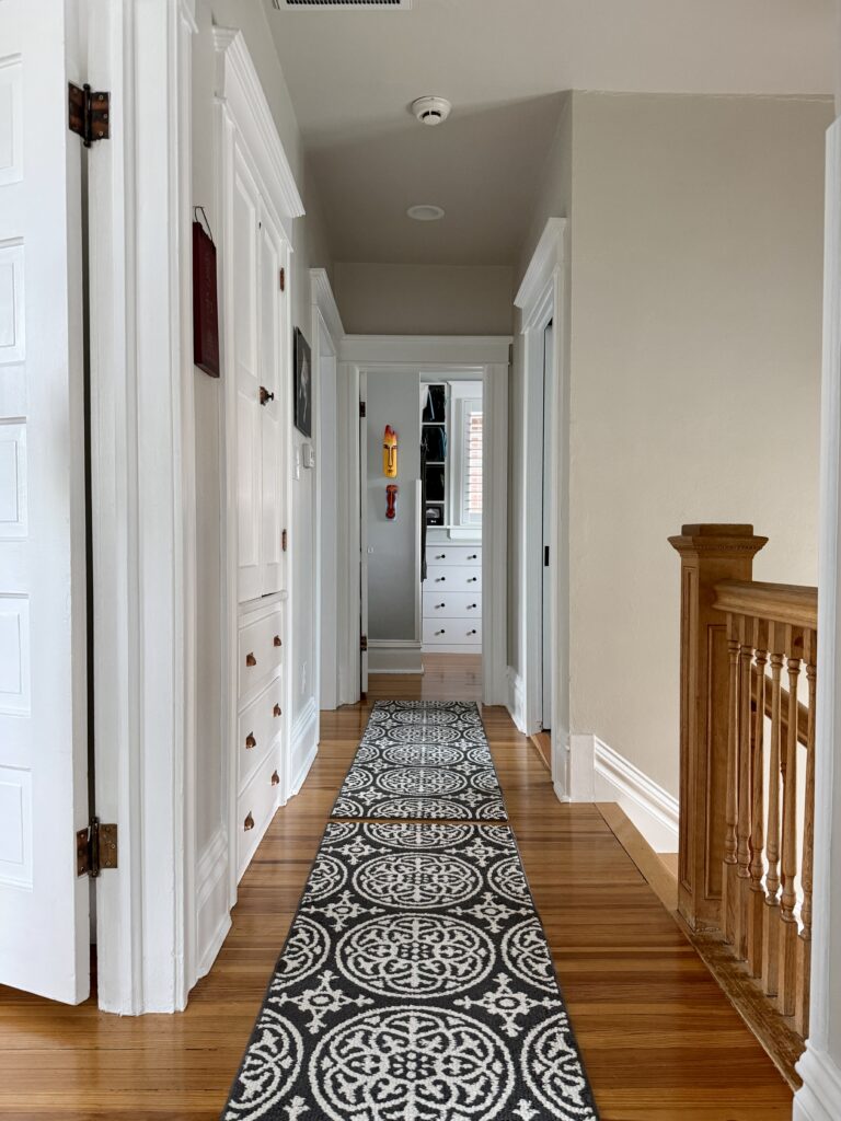 A hallway painted with Benjamin Moore Pale Oak paint, part of an interior Pale Oak color scheme.
