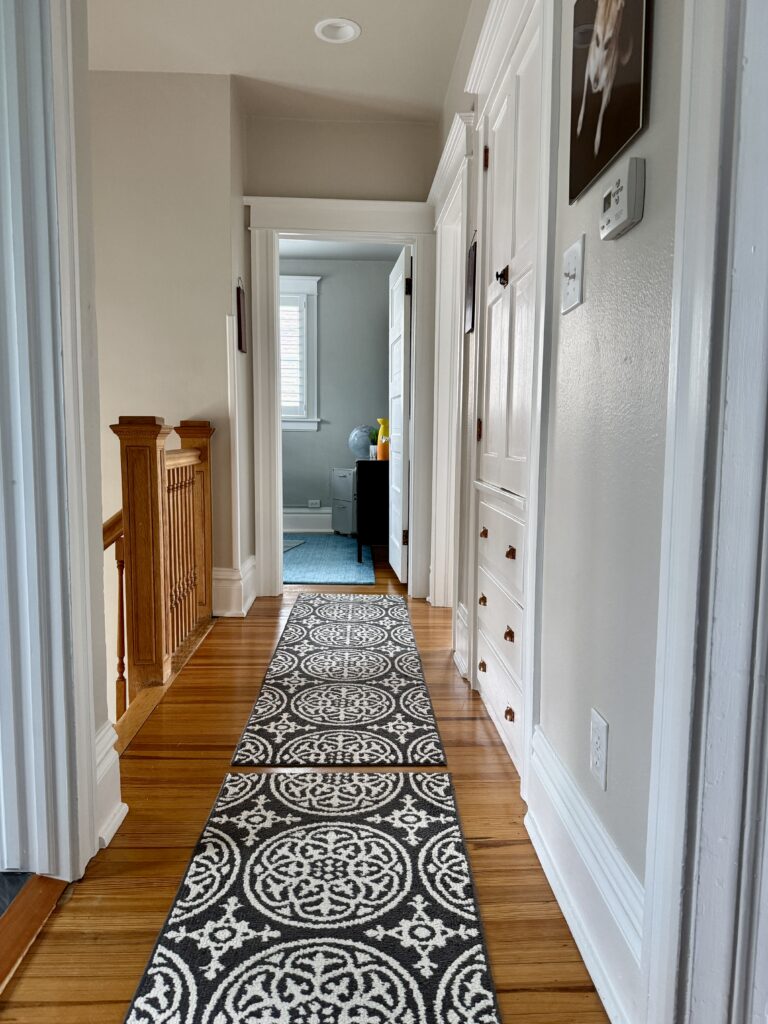 A hallway painted with Benjamin Moore Pale Oak paint, part of an interior Pale Oak color scheme.