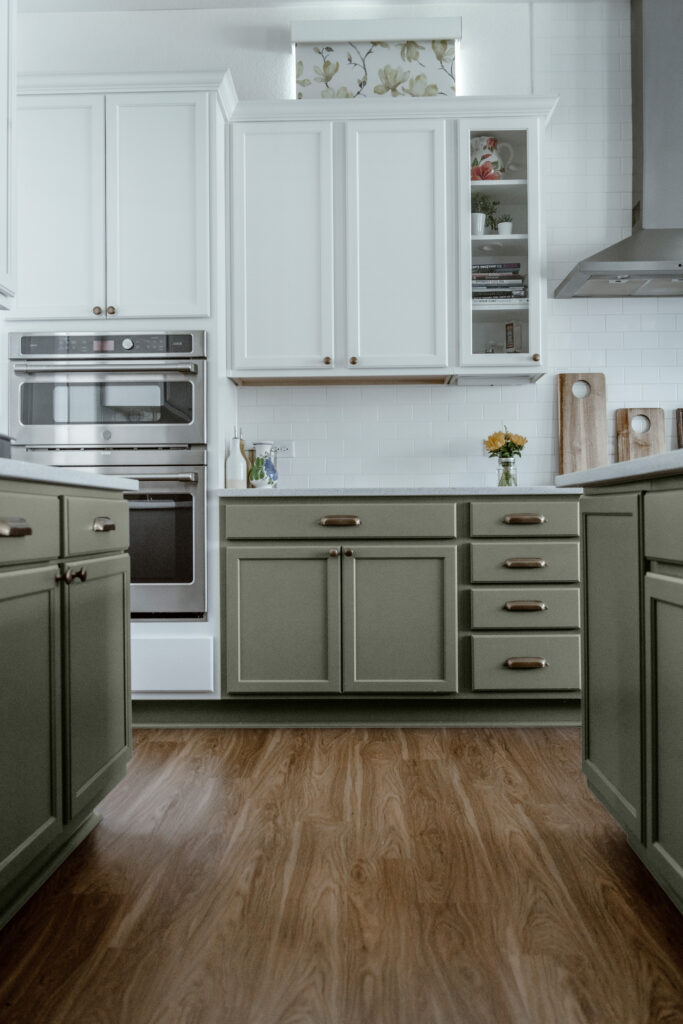 A kitchen with Sherwin-Williams Evergreen Fog lower cabinets.