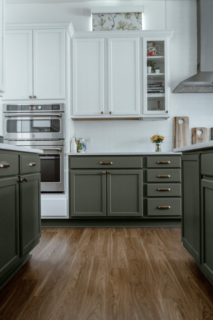 Sherwin-Williams Pewter Green Lower Cabinets with white upper cabinets.