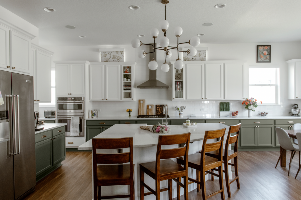 A kitchen with Sherwin-Williams Evergreen Fog lower cabinets.