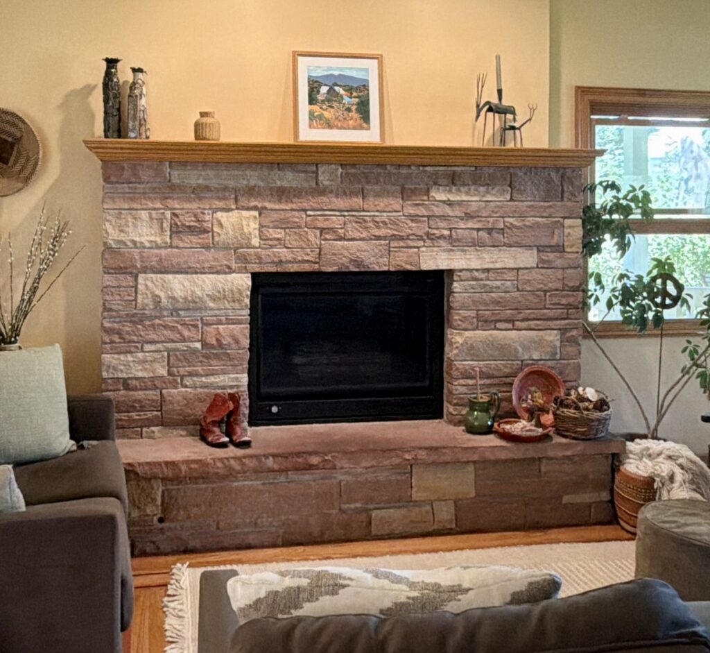 pink fireplace stone with yellow walls