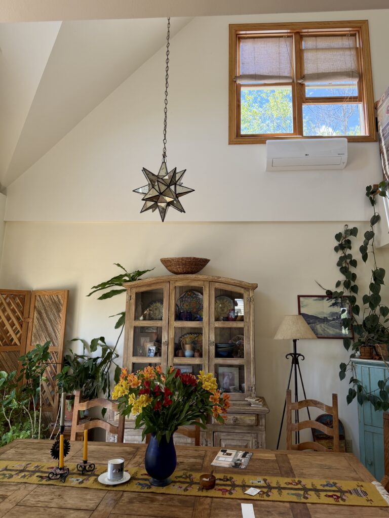 A room painted with BM Mascarpone walls with BM White Dove walls above.