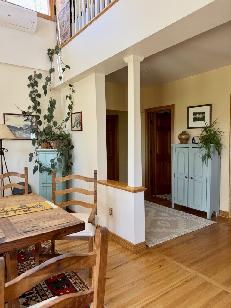 A BM Mascarpone dining room with wood trim.