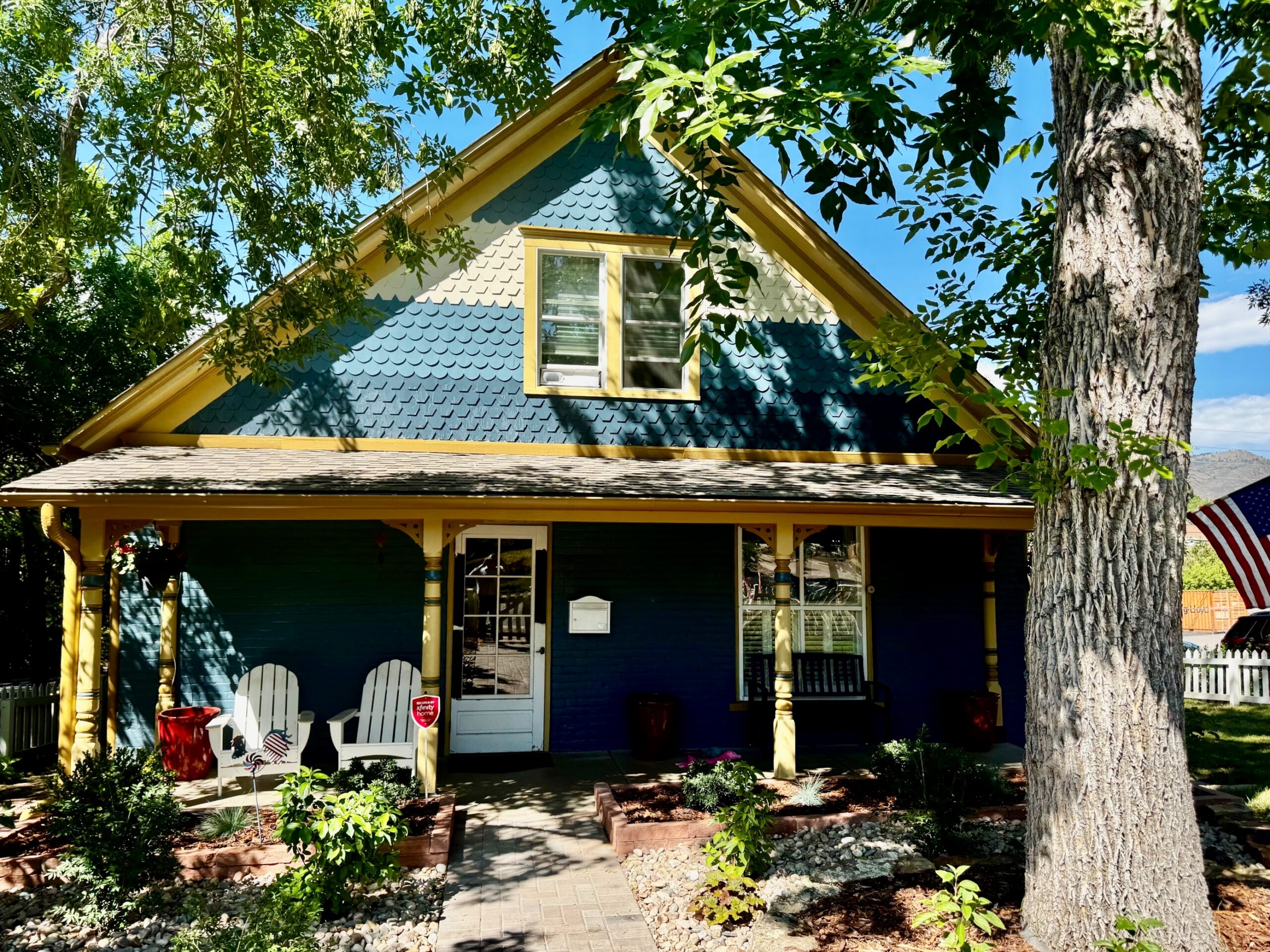 A Victorian home features a blue and yellow color palette.