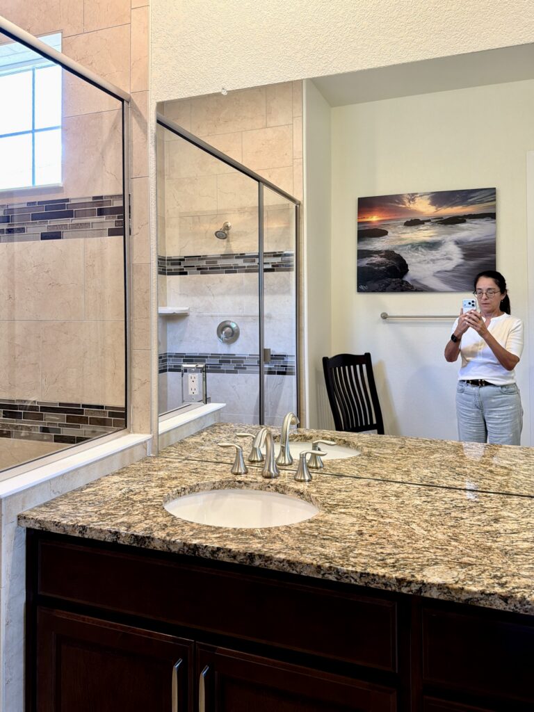 A bathroom is painted with Sherwin-Willams Dover White paint.