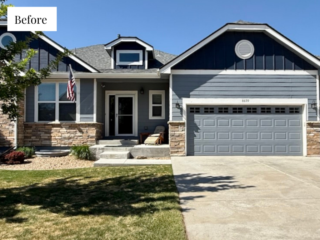 Before photo of a suburban house with muted dark blue siding, warm stone, dark gables and a front door painted to match the gables, sunny lot, Colorado