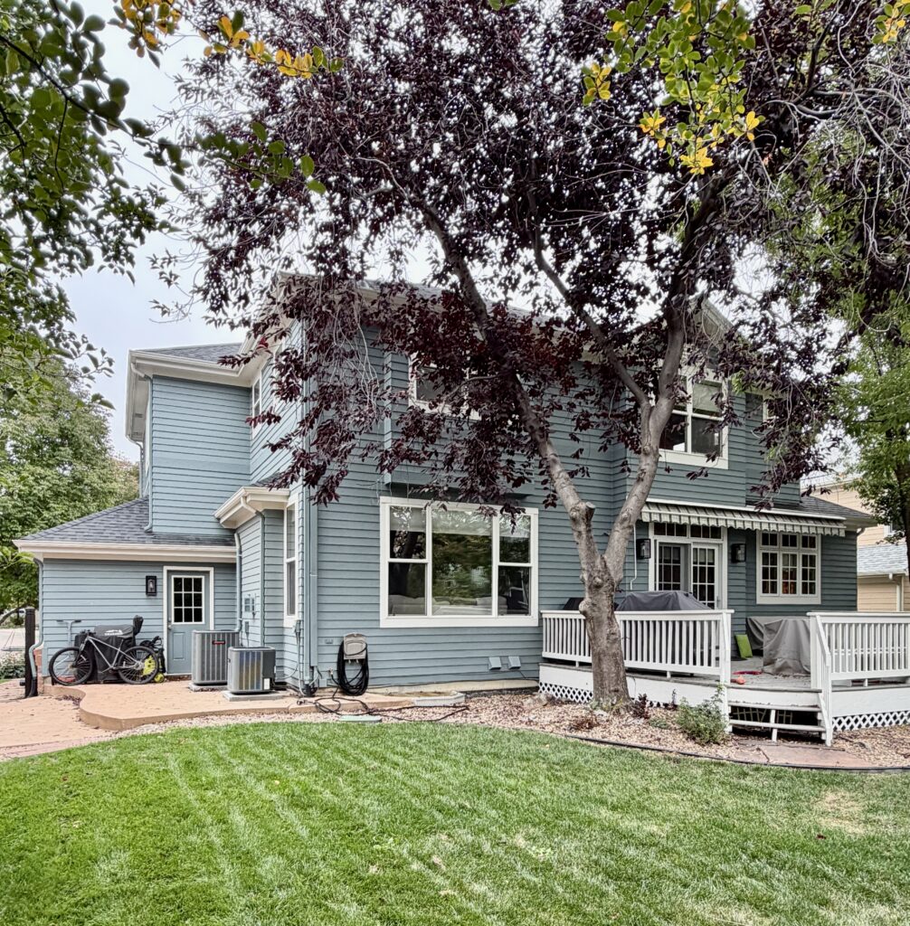 A home painted with Benjamin Moore Apollo Blue siding