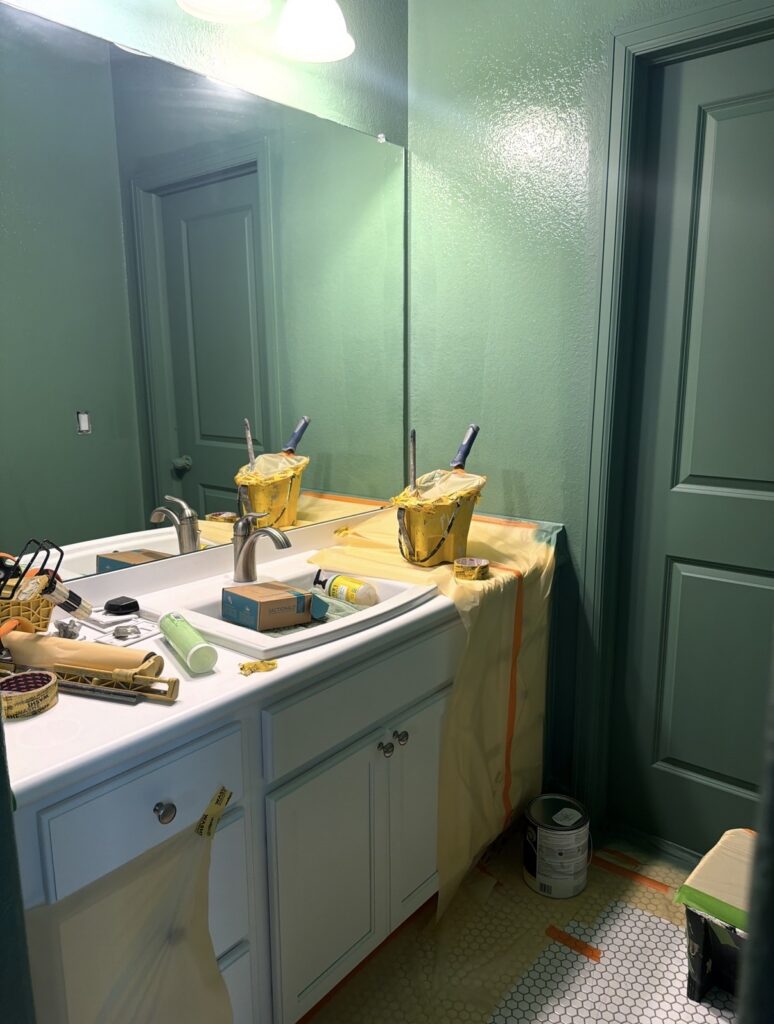 a bathroom being painted with Benjamin Moore Webster Green