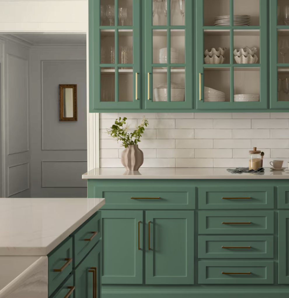 Kitchen cabinets painted with BM Webster Green, the 2027 Color of the Year from Benjamin Moore.